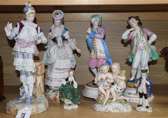 Two pairs of French porcelain figures and three other groups, tallest 33cm